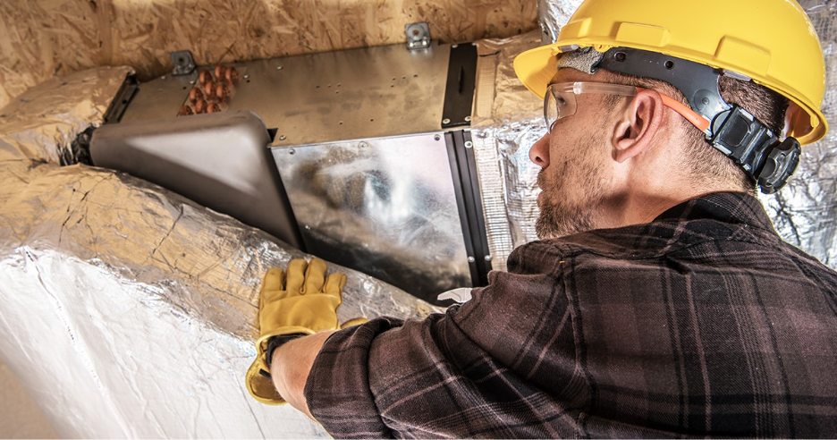 HVAC Technician Installing Ductwork