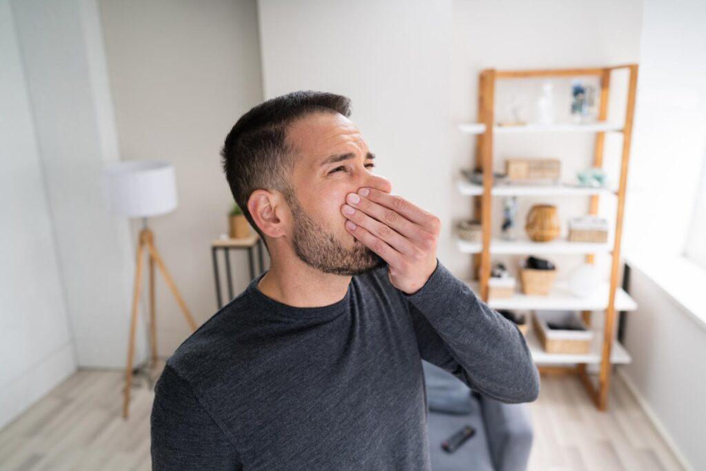 A man experiences smells from his home HVAC system.