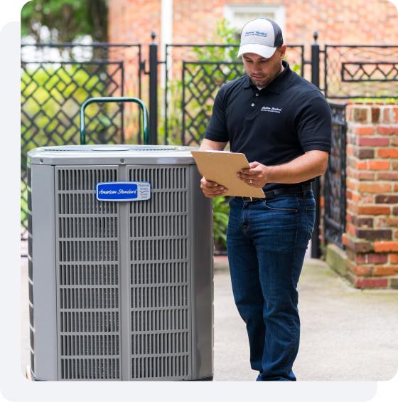 An HVAC dealer inspects a maintenance checklist.