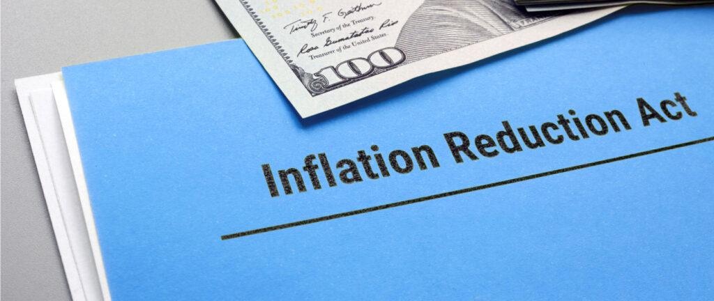 There is a blue piece of paper that reads "Inflation Reduction Act."