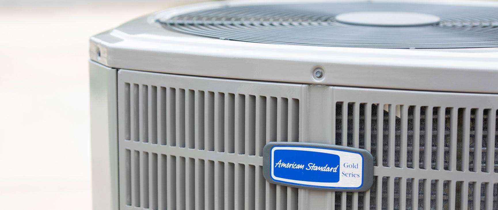 American Standard air conditioner unit in cool gray with blue company logo.