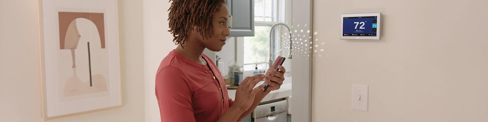 Homeowner Using the American Standard Home App.