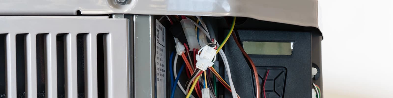 Closeup of Central AC Unit with Panel Removed, Showing Wiring