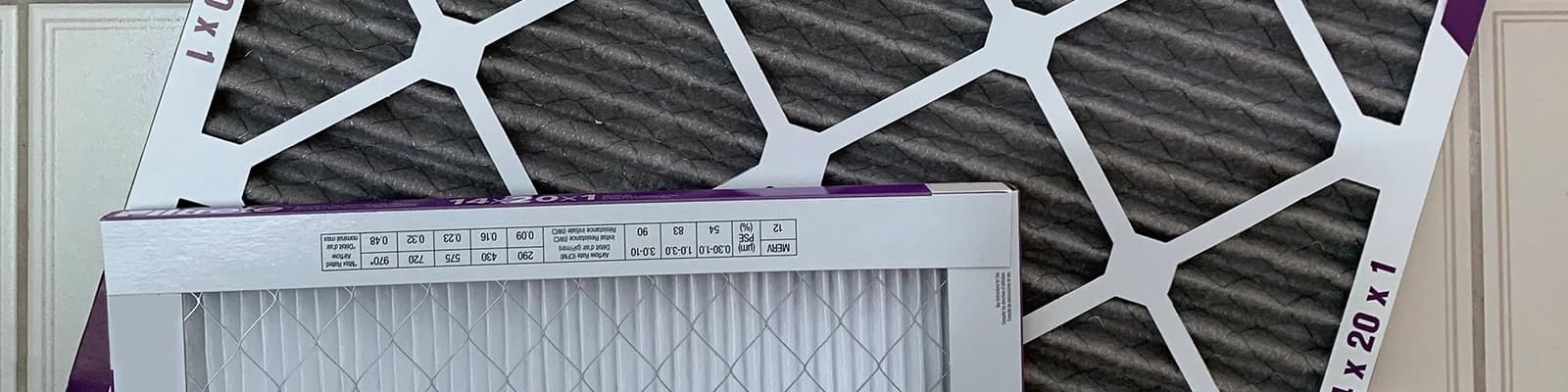 Clean and Dirty Furnace Filters with Sizes Visible