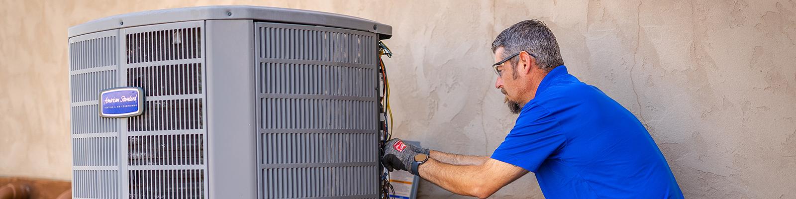 HVAC Technician Installing the HVAC Performance Monitoring Kit at the Outdoor Unit